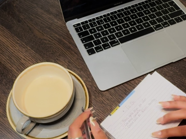 Coffee and laptop on desk
